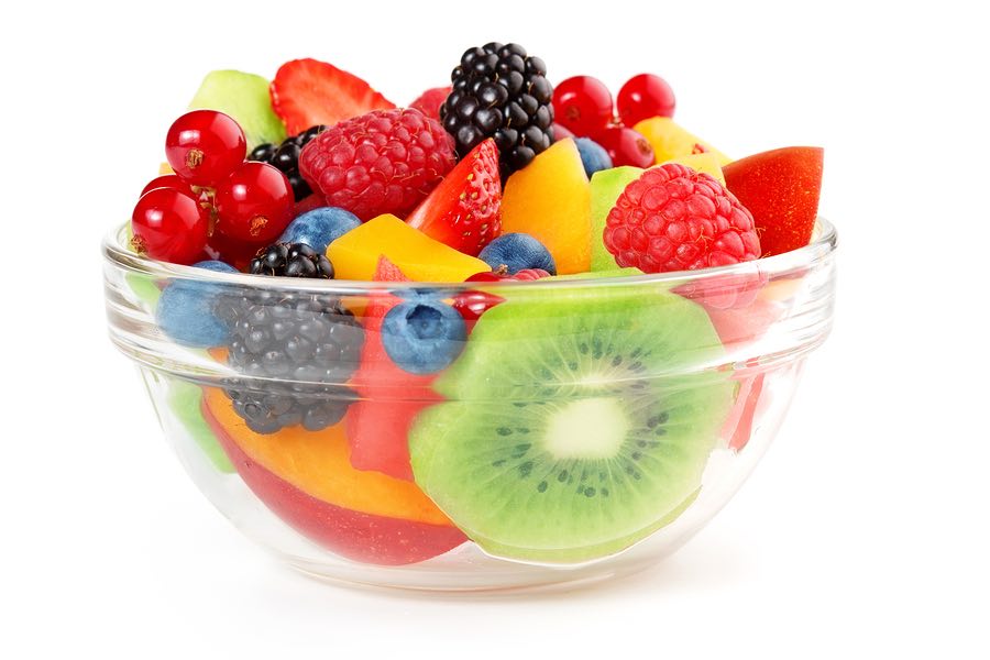 bowl of fruit salad isolated on white background